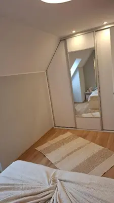 Łóżko lub łóżka w pokoju w obiekcie Przy lesie