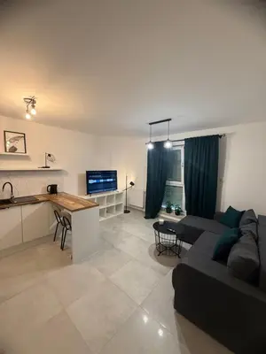Telewizja i/lub zestaw kina domowego w obiekcie LOFT APARTAMENT I Kępno