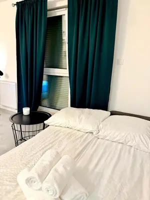 Łóżko lub łóżka w pokoju w obiekcie LOFT APARTAMENT I Kępno