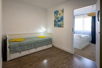 Łóżko lub łóżka w pokoju w obiekcie RentPlanet - Apartament Pułaskiego II