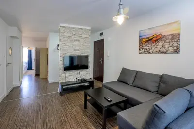 Telewizja i/lub zestaw kina domowego w obiekcie RentPlanet - Apartament Pułaskiego II