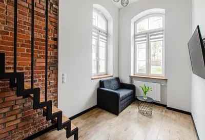 Telewizja i/lub zestaw kina domowego w obiekcie 3A Loft City Centre Apartment
