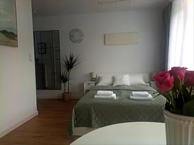 Łóżko lub łóżka w pokoju w obiekcie Słoneczne studio