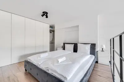 Łóżko lub łóżka w pokoju w obiekcie Bierutowska 57B by Homeprime