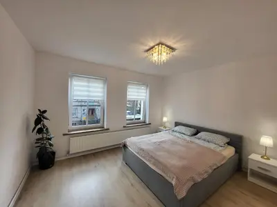 Łóżko lub łóżka w pokoju w obiekcie Apartament Daisy