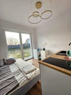 Łóżko lub łóżka w pokoju w obiekcie SmartRooms Hop to Wrocław