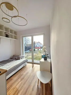 Łóżko lub łóżka w pokoju w obiekcie SmartRooms Hop to Wrocław