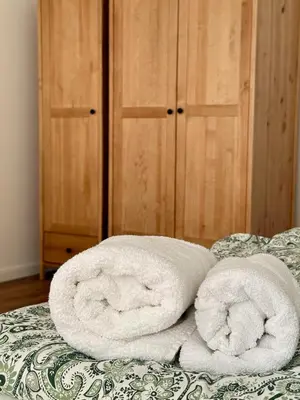 Łóżko lub łóżka w pokoju w obiekcie Apartament Mariański
