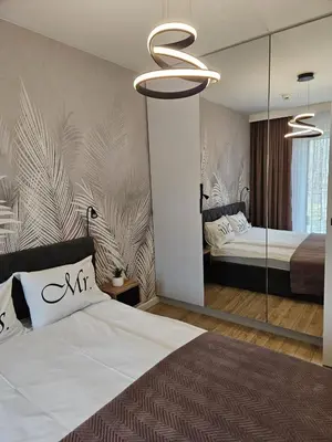 Łóżko lub łóżka w pokoju w obiekcie LAGUNA Apartament Polanica Residence 39 SPA