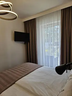 Łóżko lub łóżka w pokoju w obiekcie LAGUNA Apartament Polanica Residence 39 SPA