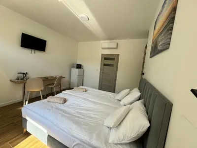 Łóżko lub łóżka w pokoju w obiekcie Słoneczne pokoje nad jeziorem Nyskim