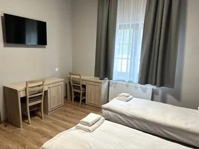 Łóżko lub łóżka w pokoju w obiekcie Karczma u Jakuba