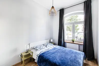 Łóżko lub łóżka w pokoju w obiekcie Loft 2 Centre Apartment