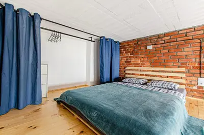 Łóżko lub łóżka w pokoju w obiekcie 4B Loft City Centre