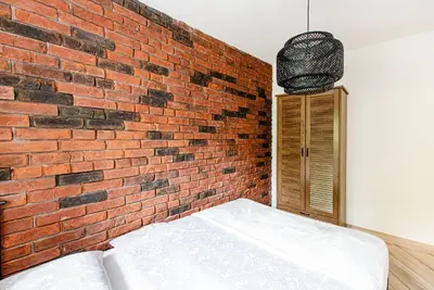 Łóżko lub łóżka w pokoju w obiekcie 12B Loft City Centre