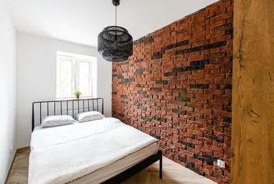 Łóżko lub łóżka w pokoju w obiekcie 12B Loft City Centre