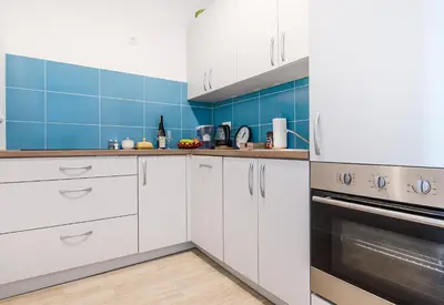 Kuchnia lub aneks kuchenny w obiekcie Apartament Turkusowy w centrum