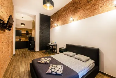Łóżko lub łóżka w pokoju w obiekcie Cosy LOFT 4 in the City Center, wi-fi, Check-in 24h