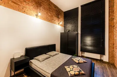 Łóżko lub łóżka w pokoju w obiekcie Cosy LOFT 4 in the City Center, wi-fi, Check-in 24h