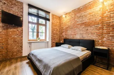 Łóżko lub łóżka w pokoju w obiekcie Loft 5 in a city centre