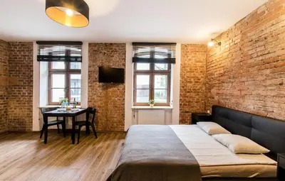 Łóżko lub łóżka w pokoju w obiekcie Loft 5 in a city centre