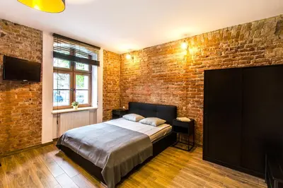 Łóżko lub łóżka w pokoju w obiekcie Loft 5 in a city centre