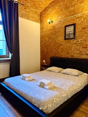 Łóżko lub łóżka w pokoju w obiekcie Loft 6 w centrum miasta