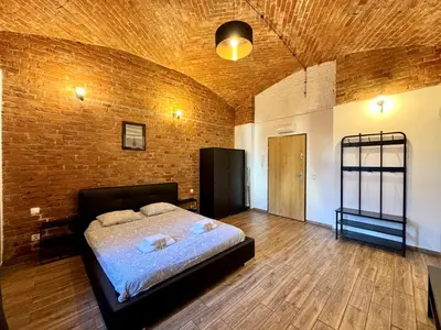 Łóżko lub łóżka w pokoju w obiekcie Loft 6 w centrum miasta