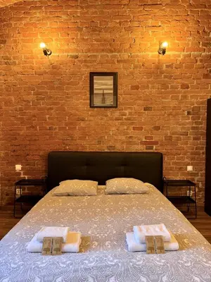 Łóżko lub łóżka w pokoju w obiekcie Loft 6 w centrum miasta