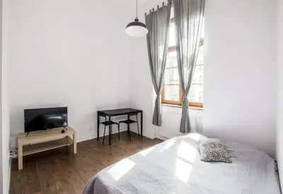 Łóżko lub łóżka w pokoju w obiekcie No 22 Old Town Apartment