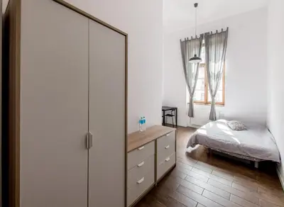 Łóżko lub łóżka w pokoju w obiekcie No 22 Old Town Apartment