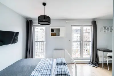 Łóżko lub łóżka w pokoju w obiekcie Teal 2 Apartment