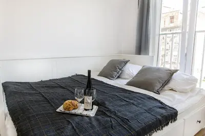 Łóżko lub łóżka w pokoju w obiekcie Grey 2 Apartment