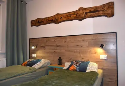 Łóżko lub łóżka w pokoju w obiekcie Apartament Szałwiowa Dolina