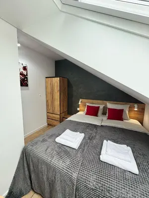 Łóżko lub łóżka w pokoju w obiekcie Apartament na Polnych Domach