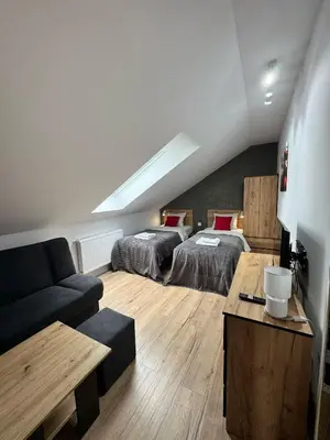 Łóżko lub łóżka w pokoju w obiekcie Apartament na Polnych Domach
