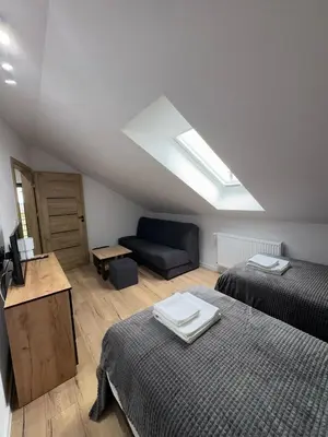 Łóżko lub łóżka w pokoju w obiekcie Apartament na Polnych Domach