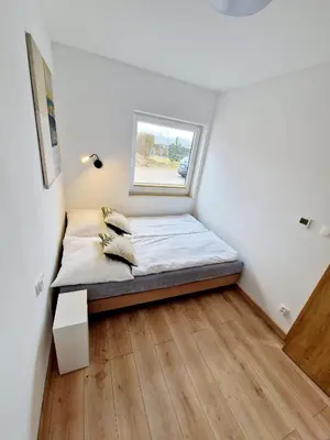 Łóżko lub łóżka w pokoju w obiekcie Domki Paula