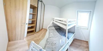 Łóżko lub łóżka w pokoju w obiekcie Domki Paula
