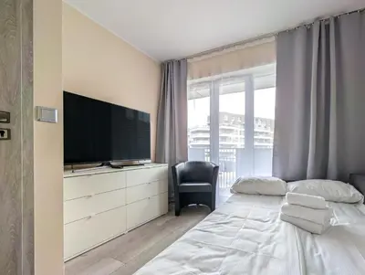 Łóżko lub łóżka w pokoju w obiekcie Jagodno Comfort Apartment by BookingHost