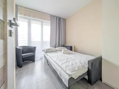 Łóżko lub łóżka w pokoju w obiekcie Jagodno Comfort Apartment by BookingHost