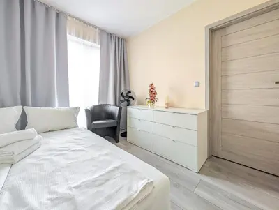 Łóżko lub łóżka w pokoju w obiekcie Jagodno Comfort Apartment by BookingHost