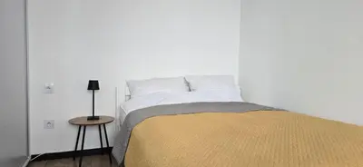 Łóżko lub łóżka w pokoju w obiekcie Apartament Typu Studio - TG