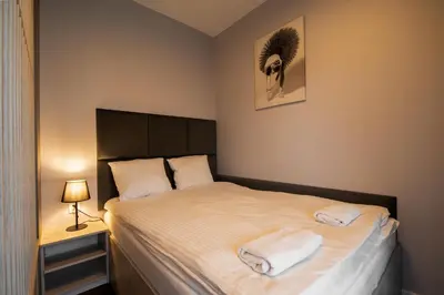 Łóżko lub łóżka w pokoju w obiekcie RentPlanet - Apartamenty Bernardyńska
