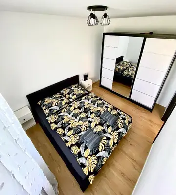 Łóżko lub łóżka w pokoju w obiekcie Apartament Krakowska - winda, parking