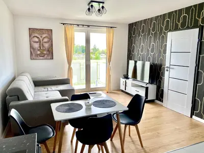 Telewizja i/lub zestaw kina domowego w obiekcie Apartament Krakowska - winda, parking