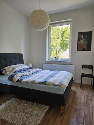 Łóżko lub łóżka w pokoju w obiekcie Tabago Studio 23 Nysa Mickiewicza