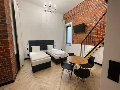 Łóżko lub łóżka w pokoju w obiekcie Apartament Deluxe 1 rynek 350 m