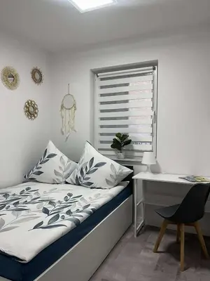 Łóżko lub łóżka w pokoju w obiekcie Apartament LUCA z balkonem