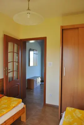 Łóżko lub łóżka w pokoju w obiekcie Domki U Tarnawy